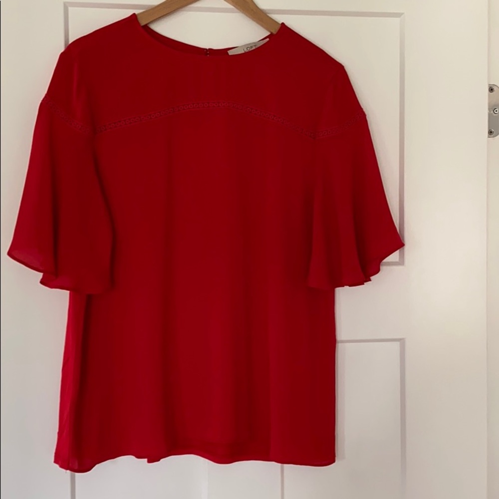 Summer top with cute detailing.